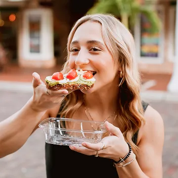 Woman eating bahia bowls